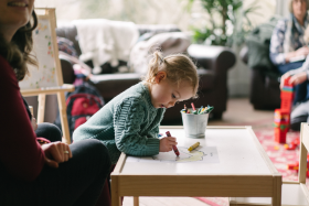 Close up o child drawing on a whiteboard table