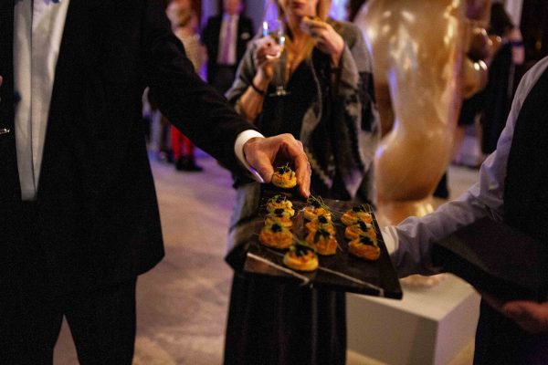 Person collecting a canape at a drinks reception at Harewood House Leeds